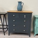 BLUE CHEST OF DRAWERS WITH OAK TOP.